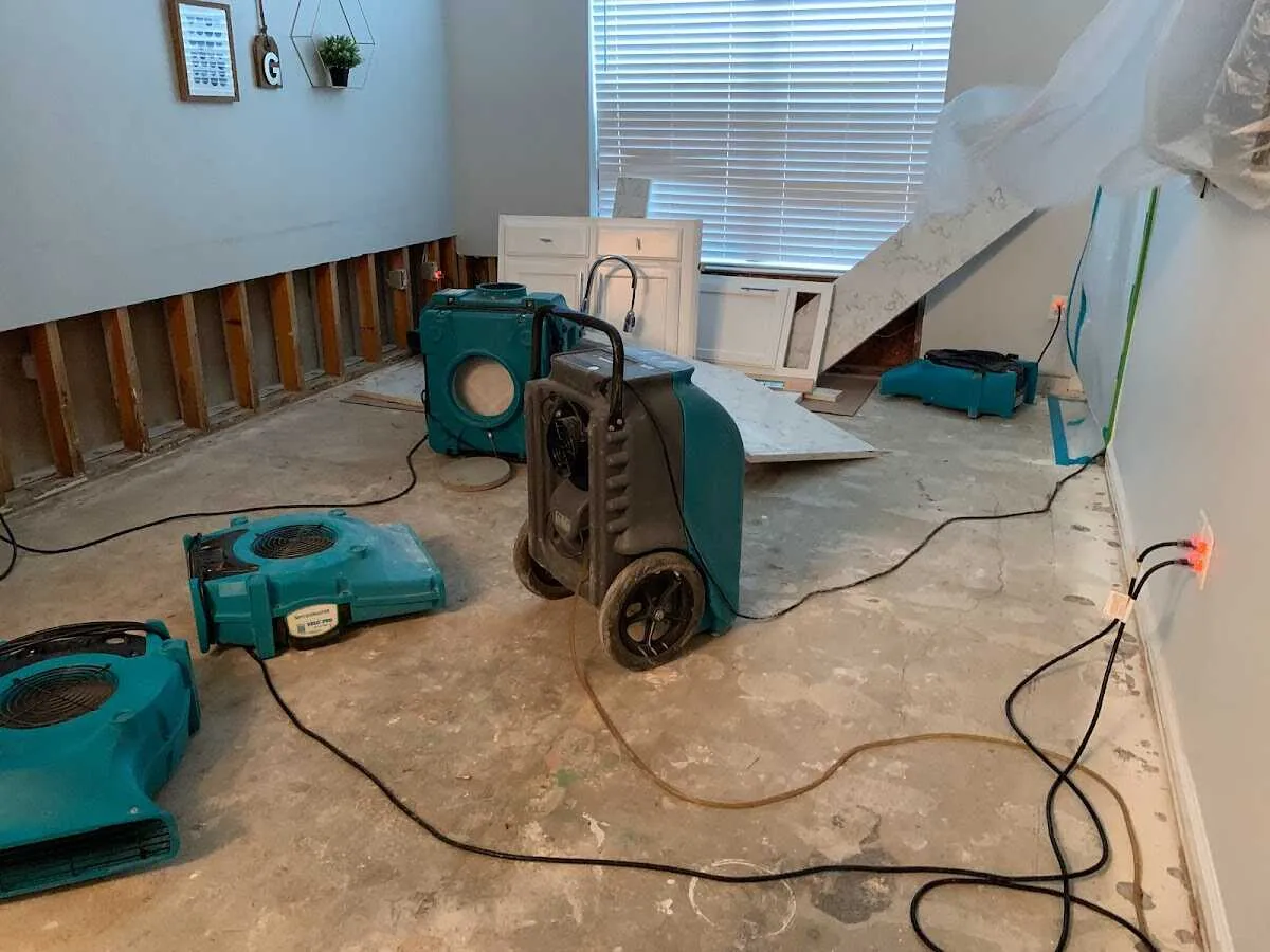Dehumidifier in flood-cut room for Water Damage Restoration in North East